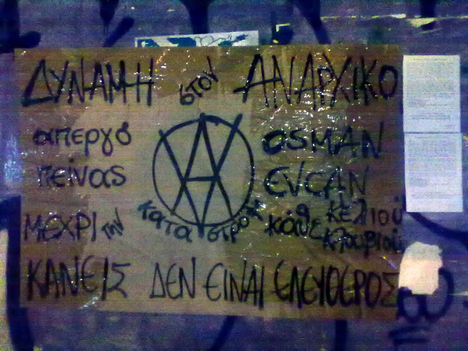 Αλληλεγγύη στον αναρχικό Osman Evcan – Πανό, αφίσα και στράτσα σε Πάτρα, Χανιά και Θεσσαλονίκη