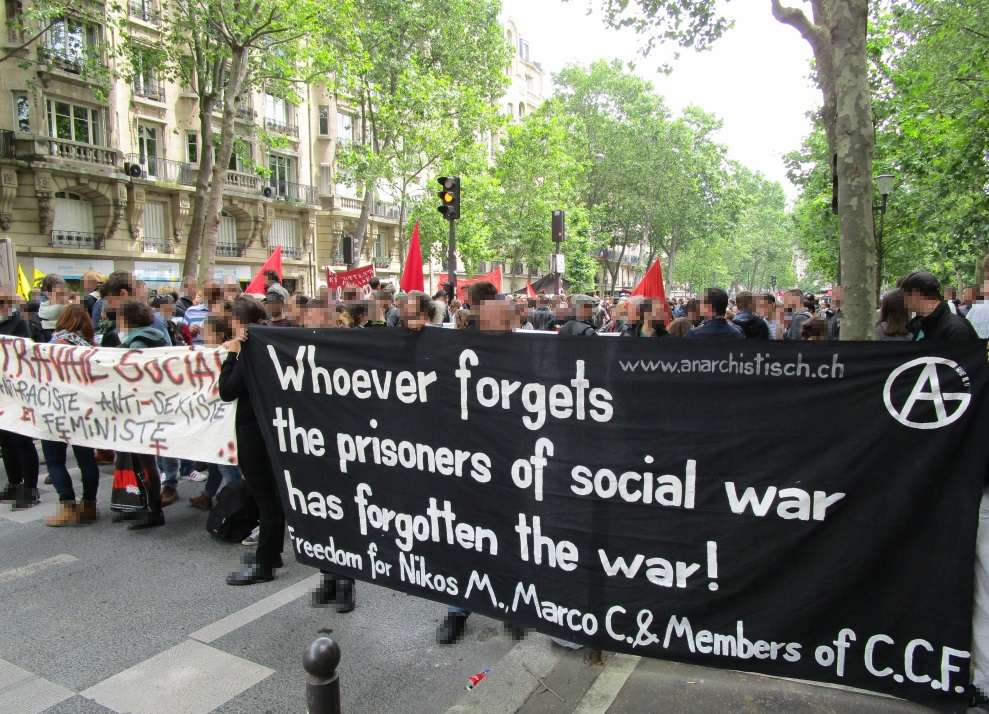 Paris: Action for political prisoners at mass street protest on June 14th