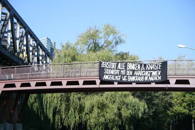 Berlin, Germany: Solidarity banners for the anarchists accused of bank robbery in Aachen