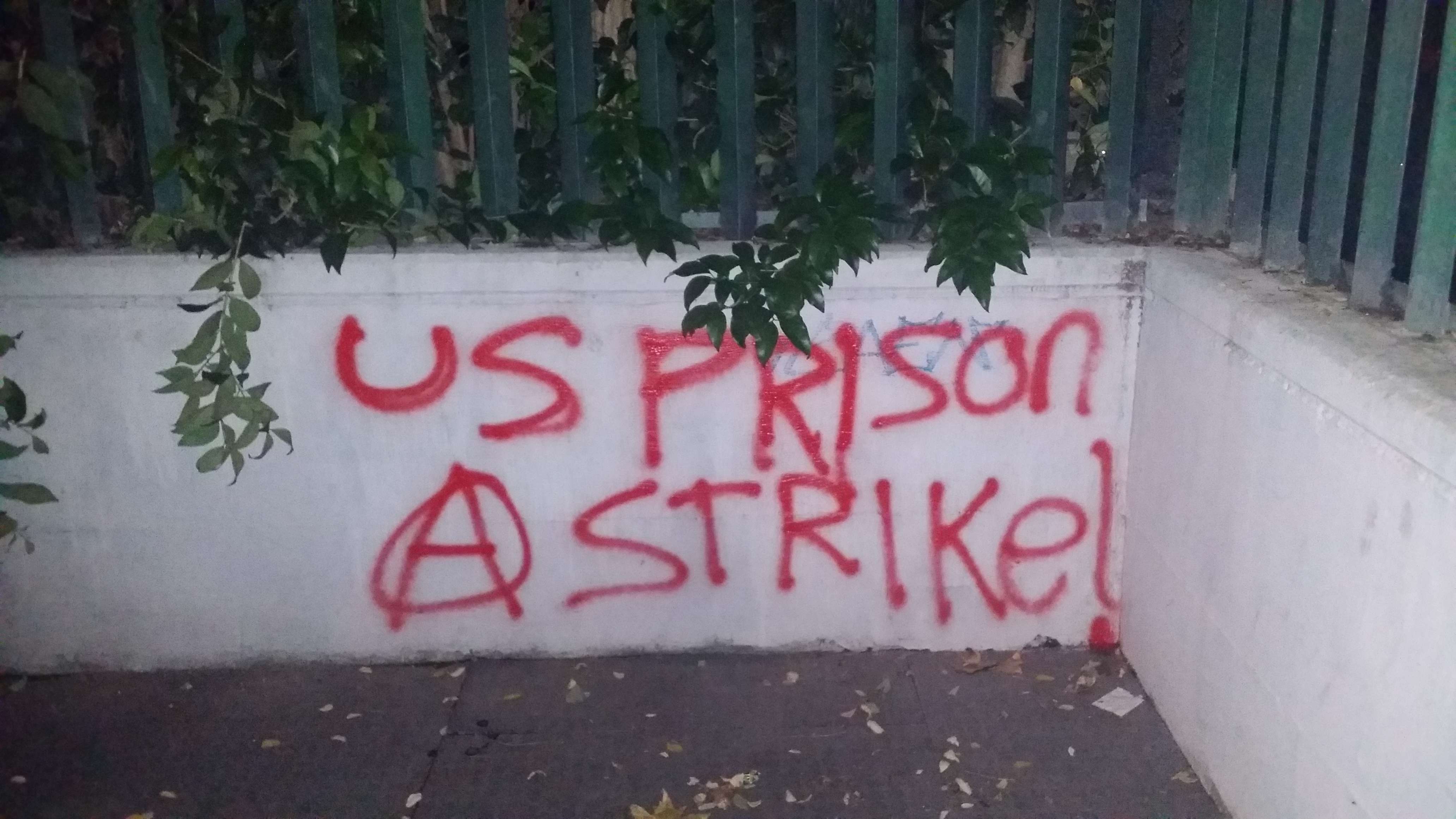 Rome, Italy: Graffiti in solidarity with the US Prison Strike