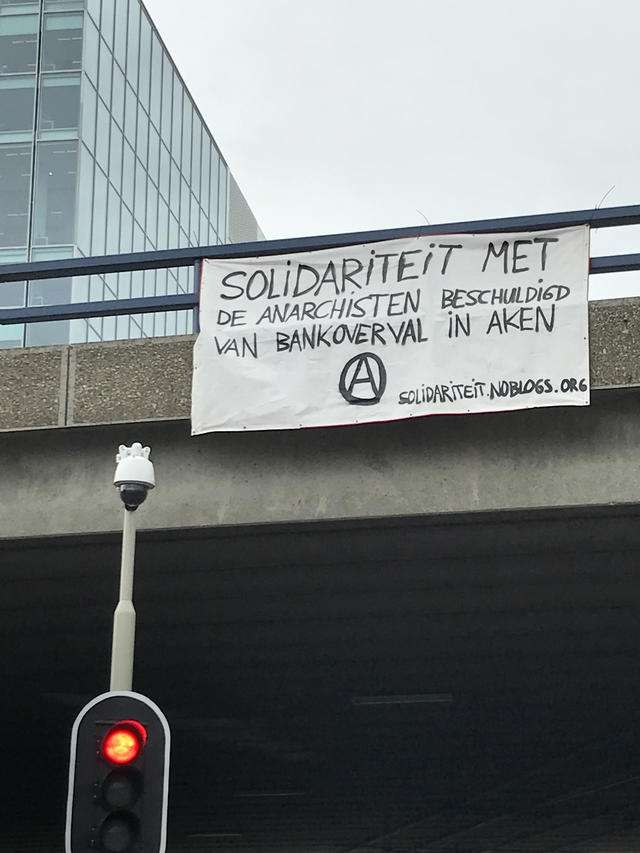 The Hague, Netherlands: May Day Solidarity Action for the Anarchists Accused of Bank Robbery in Aachen