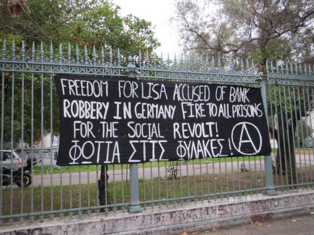 Athens, Greece: Banner in Solidarity with Anarchist Prisoner Lisa, Accused of Bank Robbery in Germany