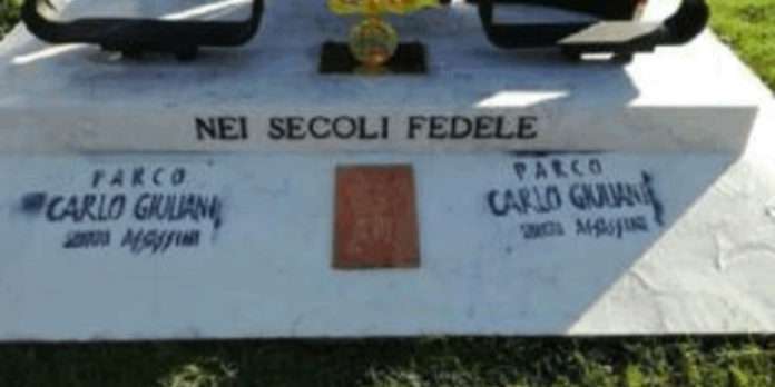 Montichiari, Italy: Damage and graffiti to a carabinieri monument